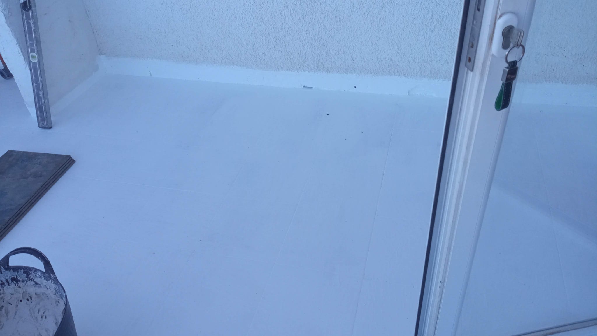 White floor tiling in progress